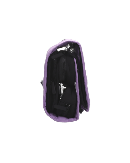 Zijaanzicht van de paarse reisset met modulaire indeling